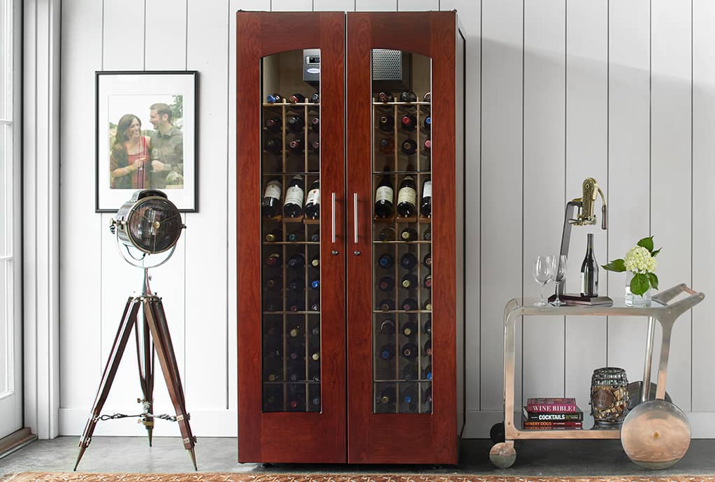 Beautiful cherry wood wine cabinet with two glass doors.