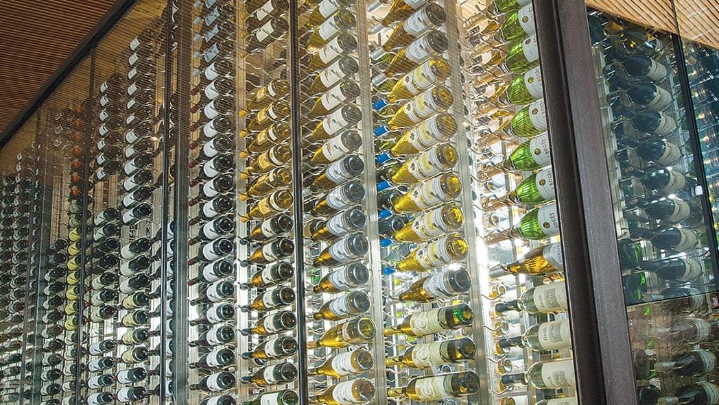 Glass enclosed modern wine cellar design. Thousands of serious wine collectors choose IWA for their custom designs.