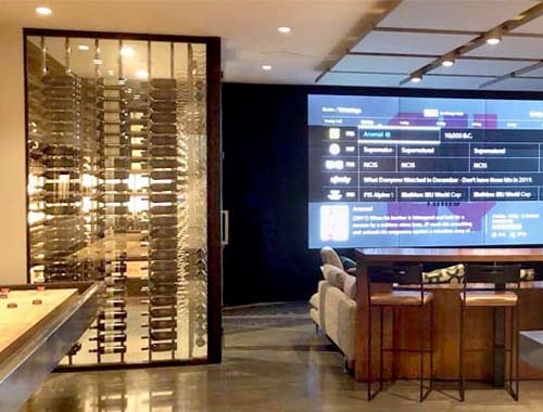 Dramatic Glass Wine Cellar in Entertainment Room