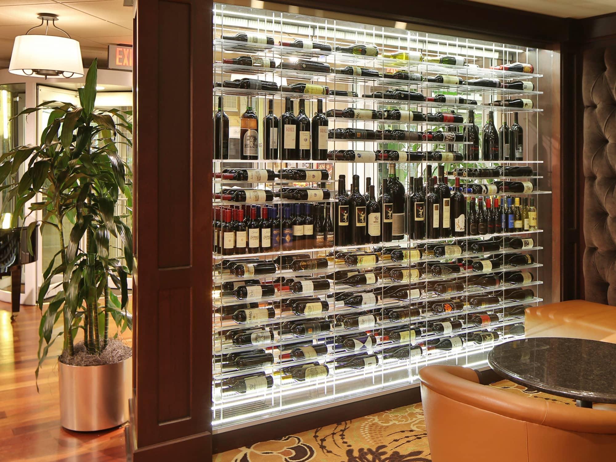 Contemporary wine cellar with backlit racking in a wood frame