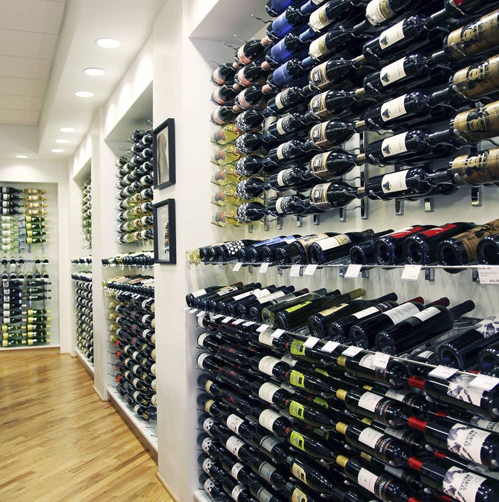 Row of wine bottles presented in a wine shop
