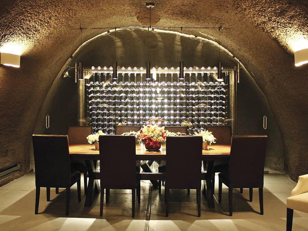 Wine cellar inside a cave with dramatic suspended wine racks