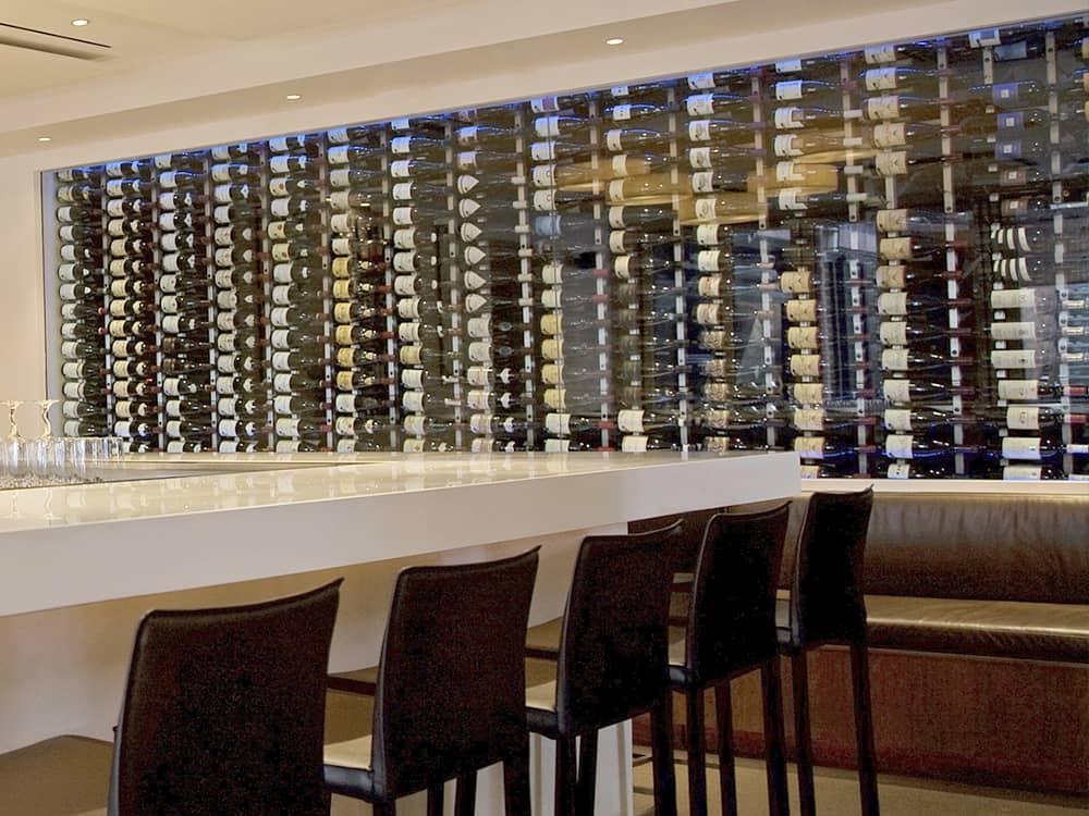 Glass wine cellar inside a dining room