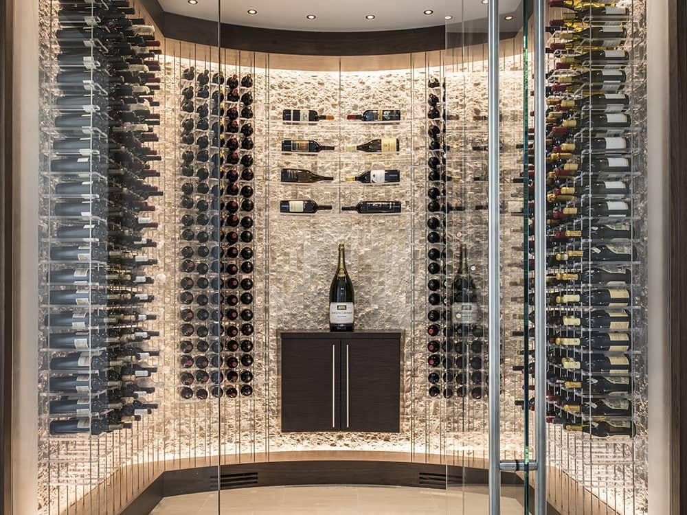 Glass enclosed wine cellar with modern wine racks