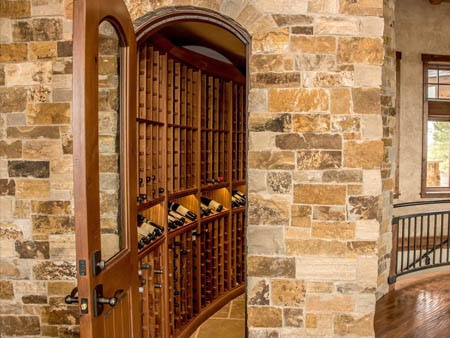 Classic wood wine cellar inside a stone tower.