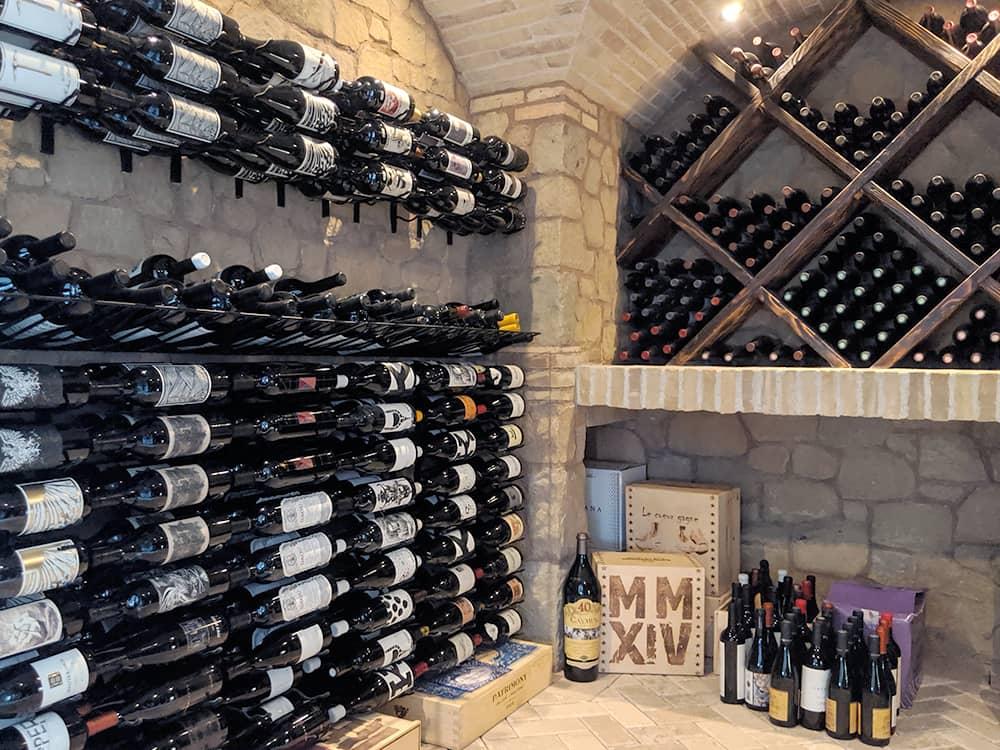 Beautiful custom wine cellar with stone walls.