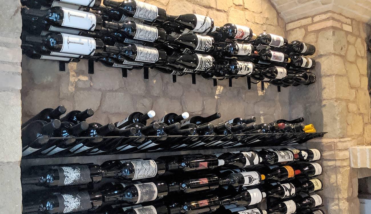 Custom wine cellar with stone walls.