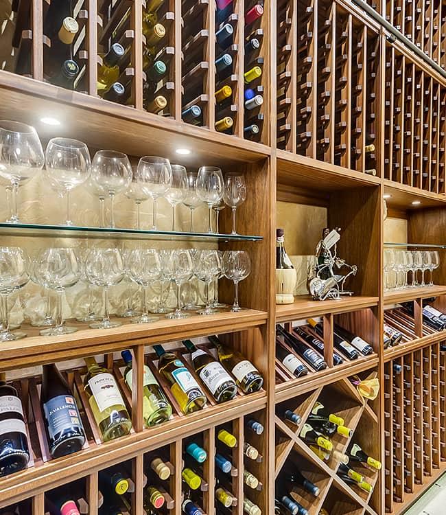 Stunning Wood Wine Racks in Custom Cellar with Display Shelves in Plano, Texas.