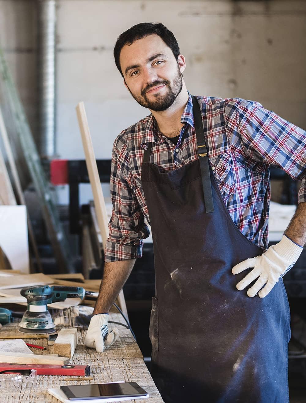 Man standing by a construction table