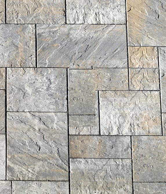 Stones cut into a variety of shapes, set into a grouped pattern