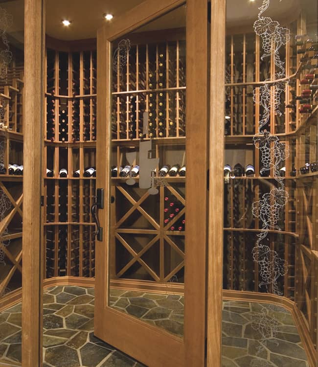 Glass enclosed wine cellar with wood framing and door