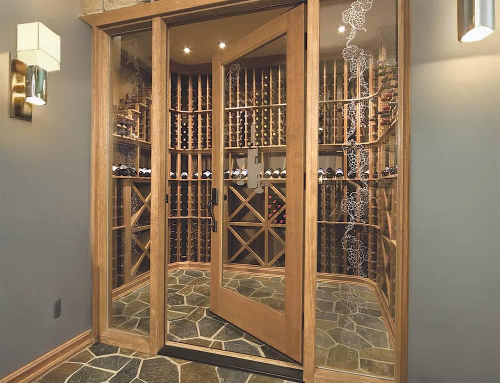 Glass enclosed wine cellar with wood frame and etching