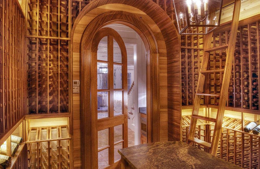 Arched wood door into a wine cellar
